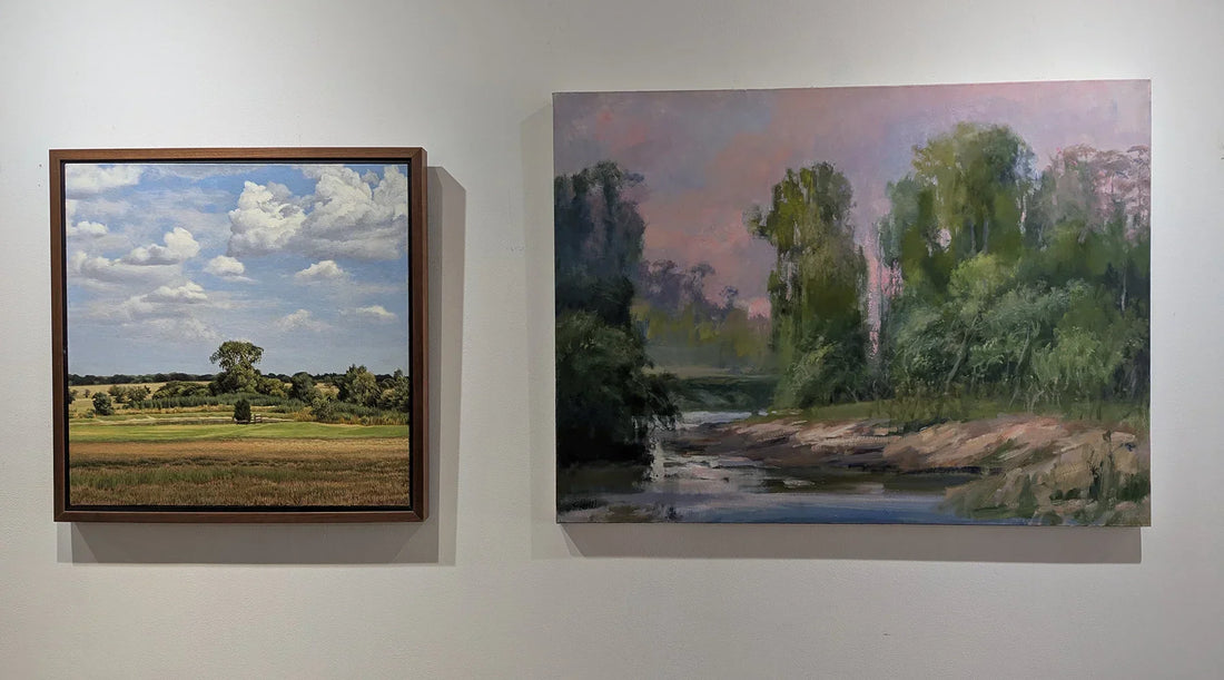 Two oil paintings depicting two Houston, Texas landscapes hang on a white wall.