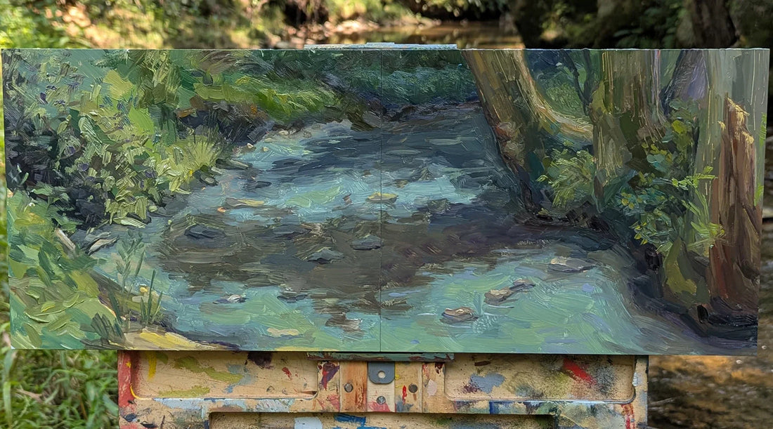 A plein air oil painting depicting a small meandering creek in the woods in Virginia.